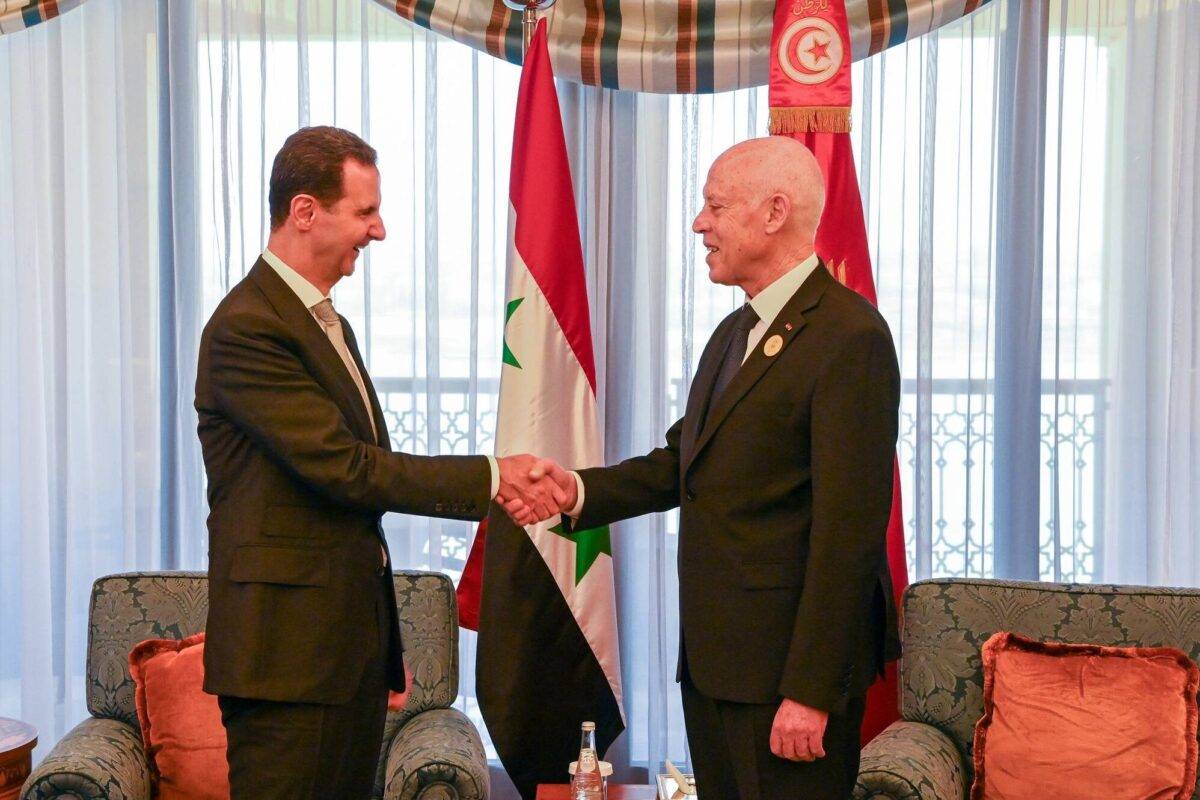 Tunisian President Kais Saied (R) meets head of Syrian regime Bashar Al Assad (L) within the 32nd Arab League Summit in Jeddah, Saudi Arabia on May 19, 2023 [Tunisian Presidency/Anadolu Agency]