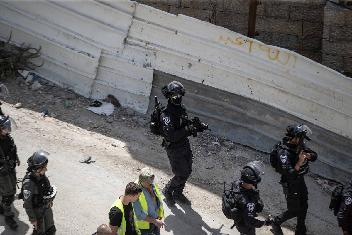 Israeli forces take security measures as Israeli forces demolish a building belonging to Palestinians claiming that it was unlicensed at Jabel Mukaber Neighborhood in East Jerusalem on May 24, 2023 [Mostafa Alkharouf - Anadolu Agency]