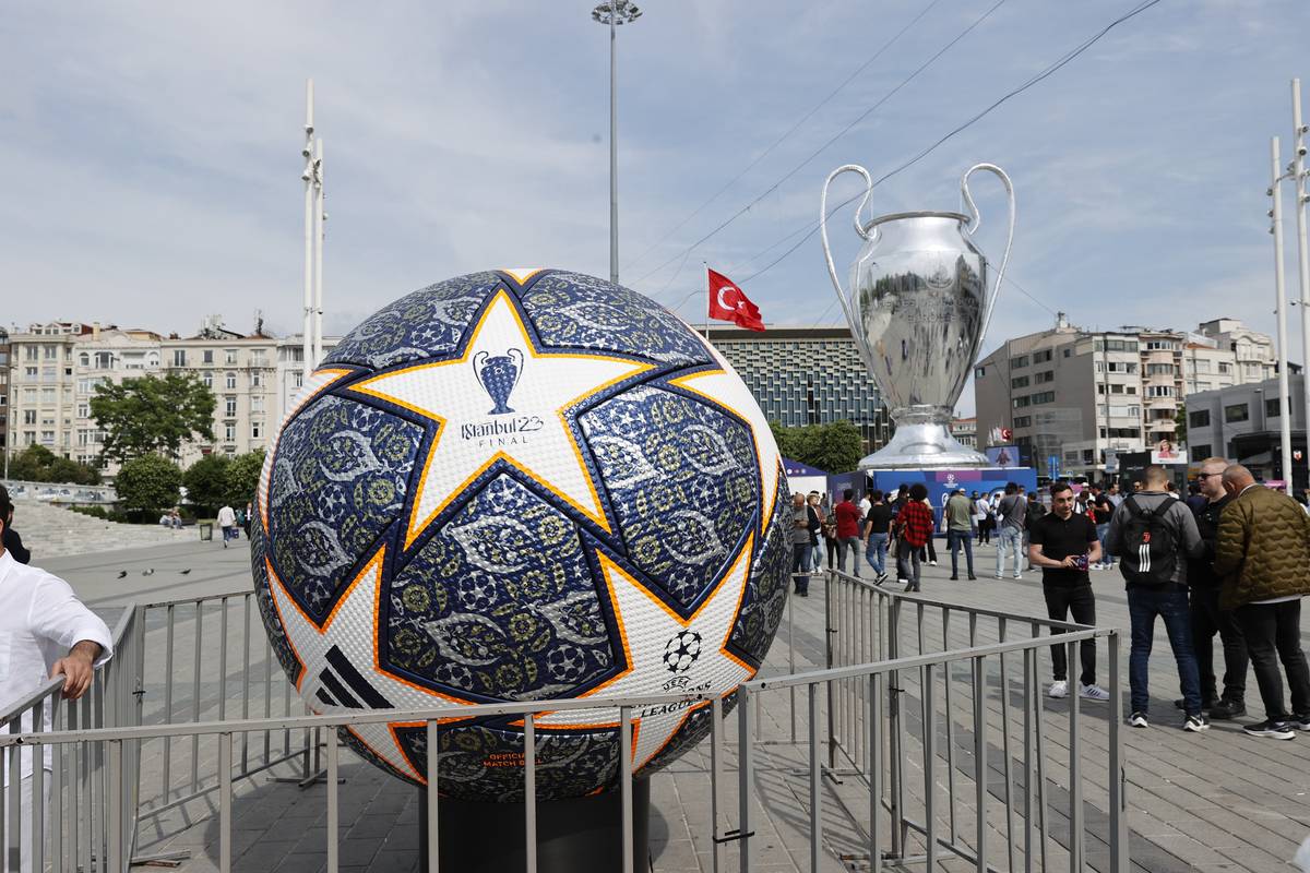 Giant model of UEFA Champions League trophy and a model of a football is displayed at the Taksim Square at the Ataturk Olympic Stadium in Istanbul, Turkiye on June 08, 2023 [Ömer Faruk Yıldız/Anadolu Agency]