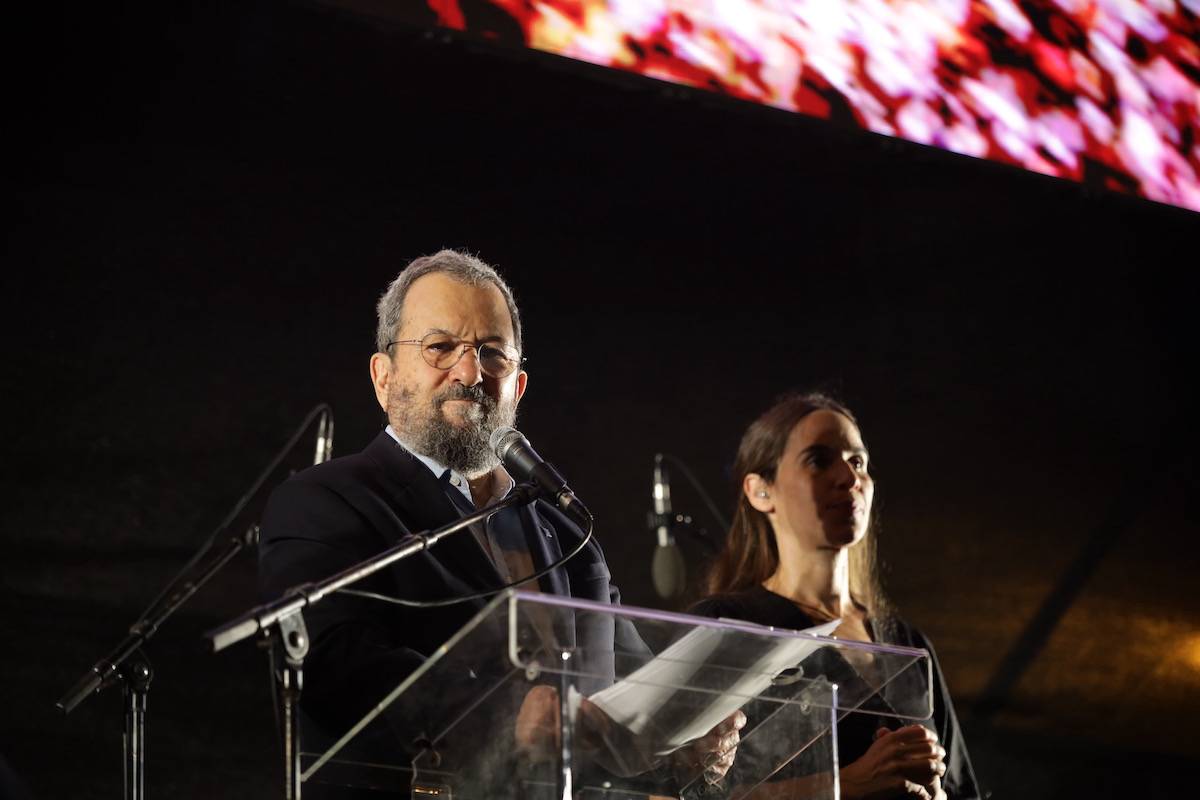 Former Israeli Prime Minister Ehud Barak addresses the crowd as the demonstrators hold banners and placards gather to protest against Israeli Prime Minister Benjamin Netanyahu's government's regulations restricting the powers of the judiciary in Tel Aviv, Israel on June 24, 2023 [Saeed Qaq - Anadolu Agency]