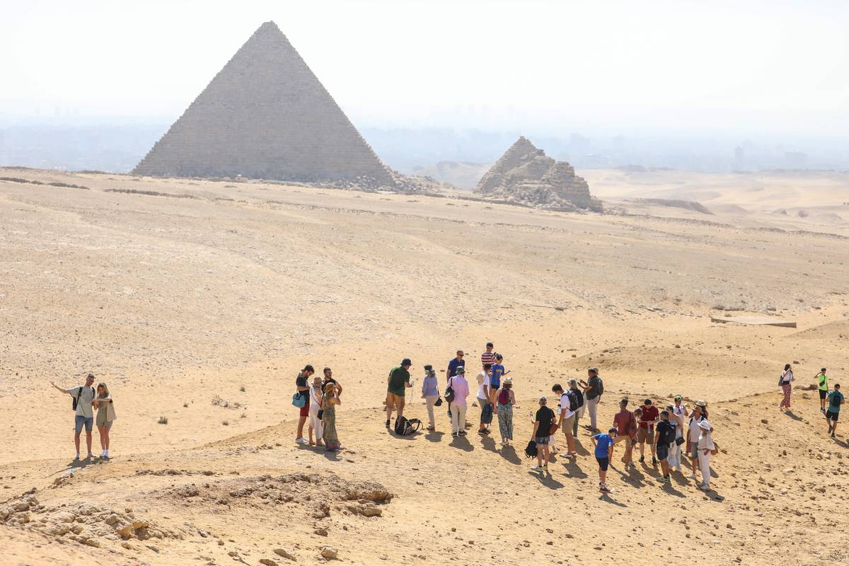 Tourists flock to the Pyramids of Giza, namely Cheops, Khafre and Menkaure on the second day of Eid Al-Adha in Giza, Egypt on June 29, 2023 [Mohamed El-Shahed - Anadolu Agency]