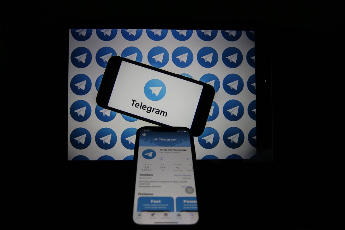 Logos of “Telegram” are displayed on mobile phone screen and computer screen on June 30, 2023 [Cem Genco/Anadolu Agency]