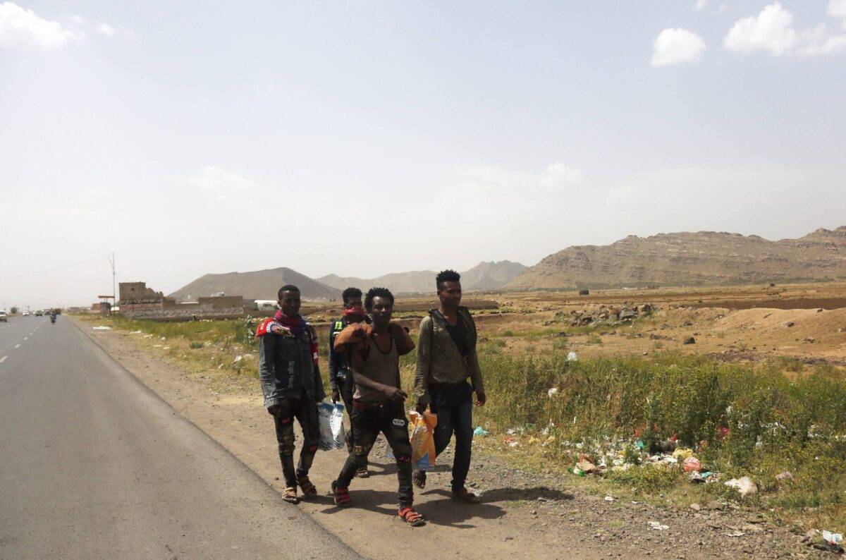 African immigrants seeking asylum in the Gulf States walk on foot along a highway leading to Saadah province to cross into Saudi Arabia, ahead of the World Refugee Day on June 17, 2023 in Yemen. [Mohammed Hamoud/Getty Images]