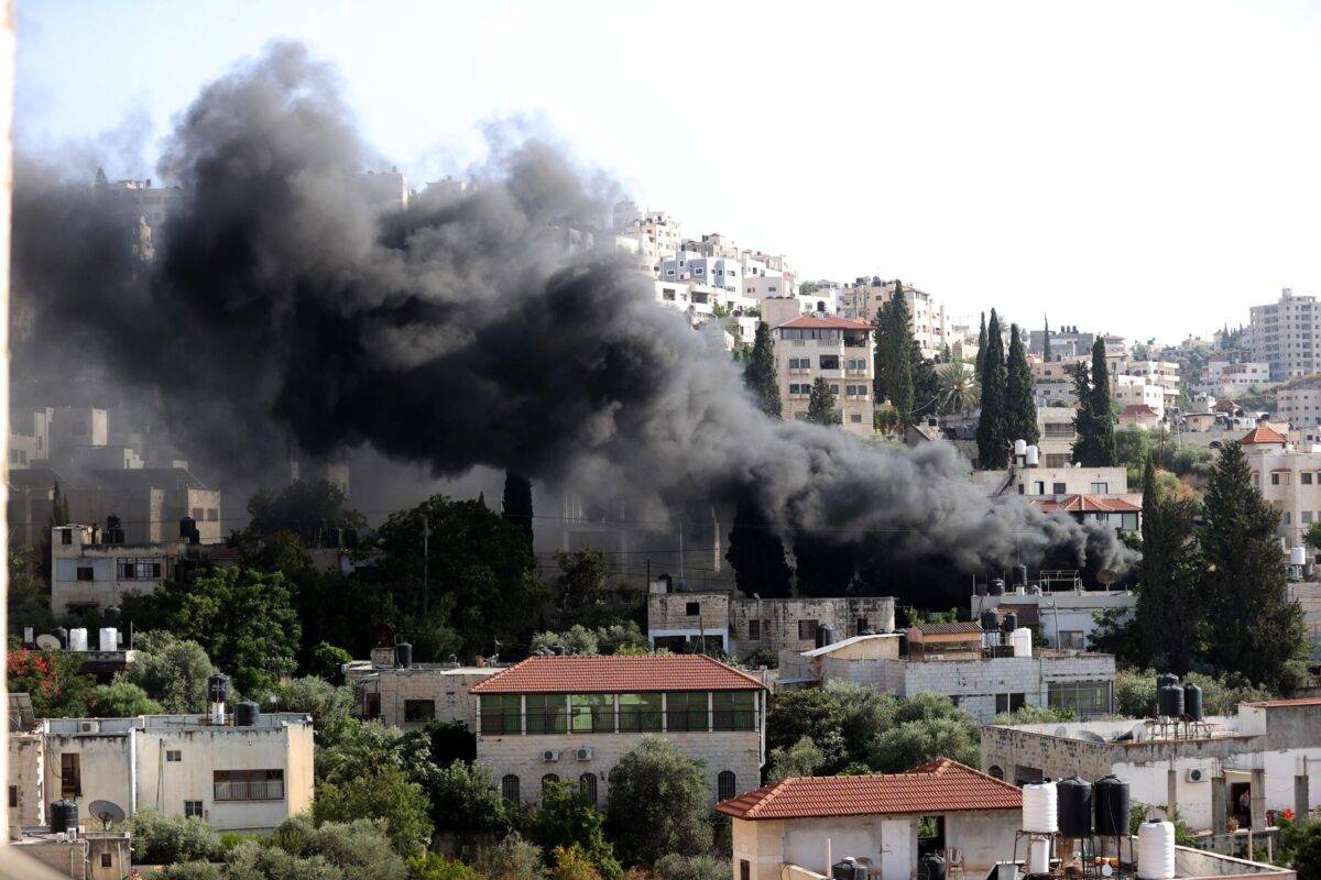 Smoke rises after Israeli forces continuing to conduct airstrike and raid on the second day in Jenin, West Bank on July 04, 2023 [Issam Rimawi/Anadolu Agency]