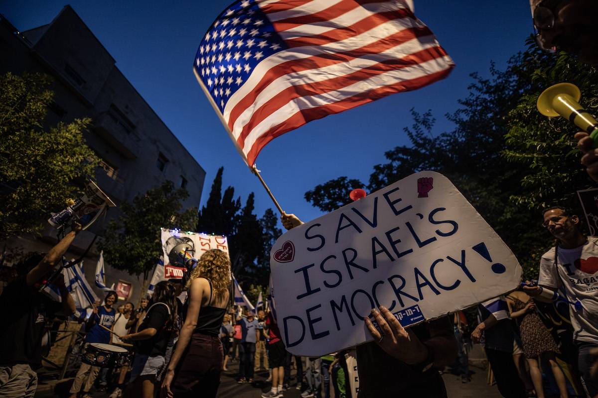 People stage a protest against Israeli Prime Minister Benjamin Netanyahu's government's judicial regulations, on July 13, 2023 in West Jerusalem. [Mostafa Alkharouf - Anadolu Agency]
