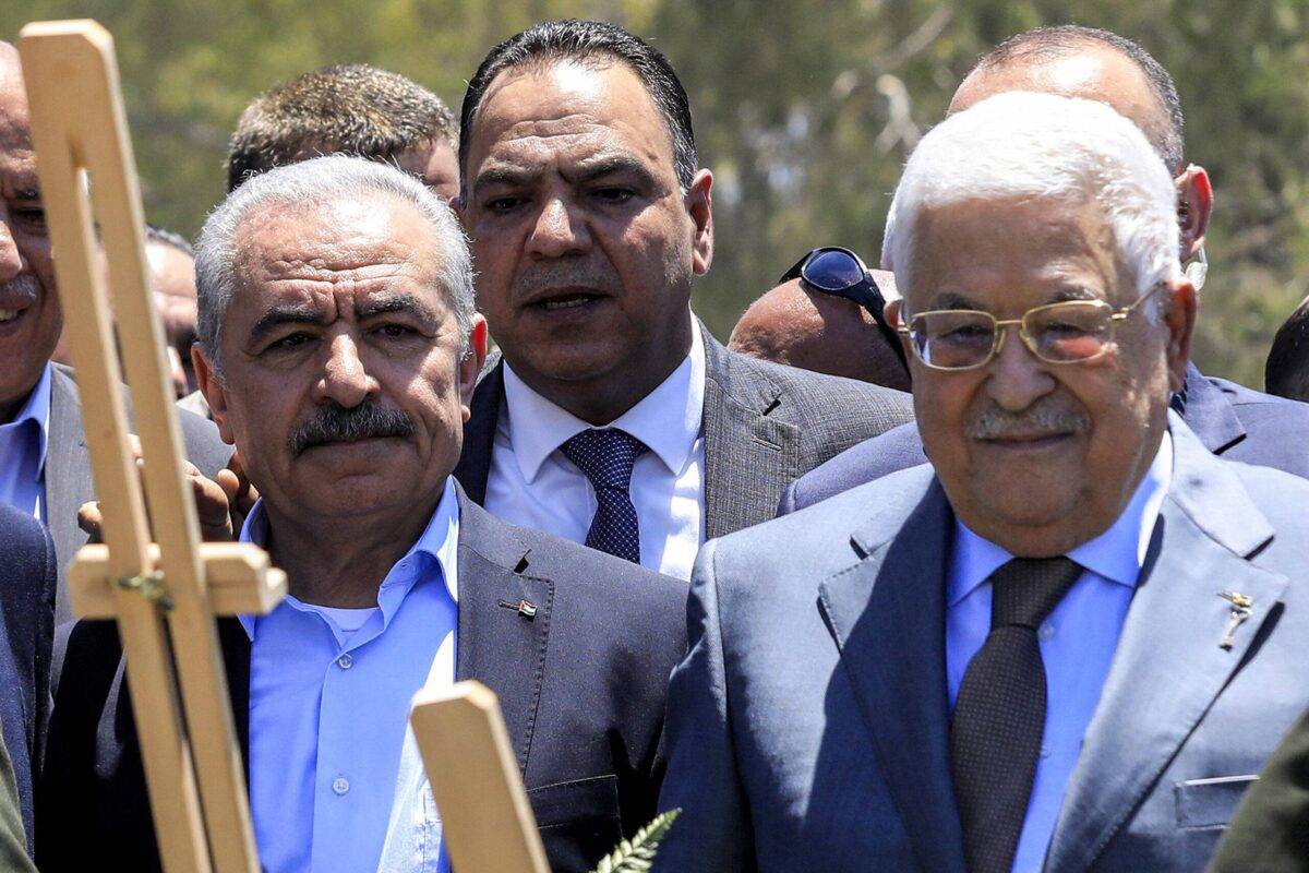 Palestinian president Mahmud Abbas (C-R) and Prime Minister Mohammad Shtayyeh (C-L) arrive to lay a wreath of flowers by the graves of Palestinians killed in recent Israeli military raids on the Jenin camp, north of the occupied West Bank on July 12, 2023 [ZAIN JAAFAR/AFP via Getty Images]