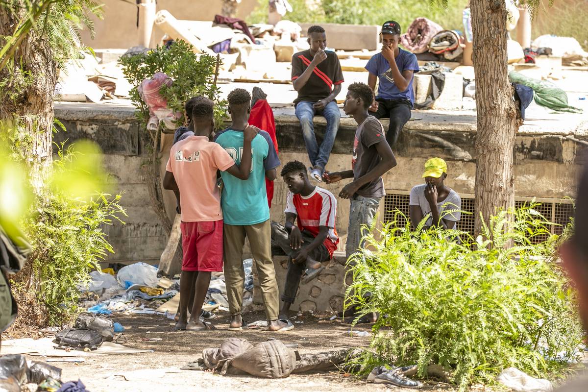 Sudanese irregular migrants live under difficult conditions in a park in Sfax province of Tunisia, as they wait for an opportunity to seek asylum in Europe illegally, on August 12, 2023. [Yassine Gaidi - Anadolu Agency]