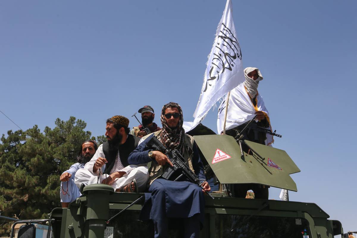 Taliban members holding flags celebrate on the 2nd anniversary of Taliban takeover in Kabul, Afghanistan on August 15, 2023. [Bilal Güler - Anadolu Agency]