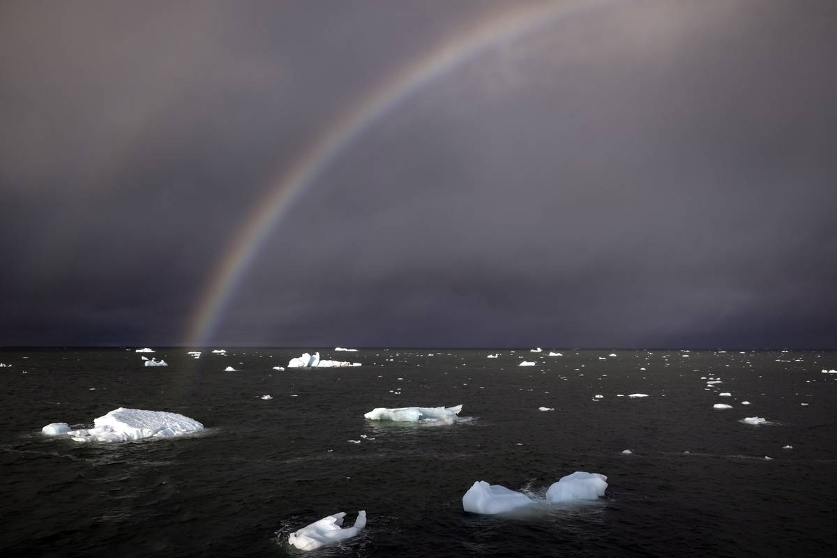 A view of partially glaciers as rainbow appears on July 16, 2023 in Svalbard and Jan Mayen. [Şebnem Coşkun - Anadolu Agency]