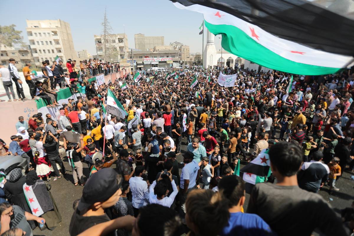 People gather to protest against Bashar al-Assad regime in al-Bab district of Aleppo, Syria on August 25, 2023. [Bekir Kasım - Anadolu Agency]