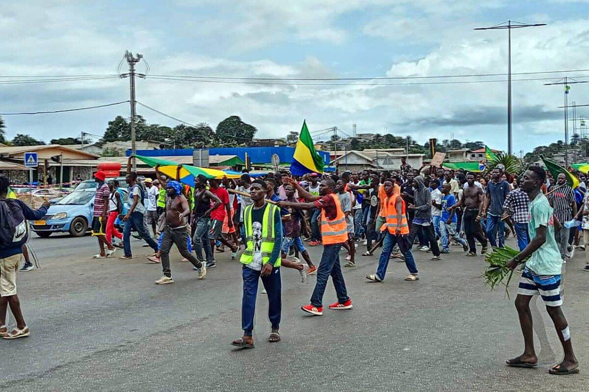 Supporters of the military administration gather on a street after Gabonese army officers enter the national television building following the announcement of the presidential election results and announce that they take over, in Libreville, Gabon on August 30, 2023 [Stringer/Anadolu Agency]