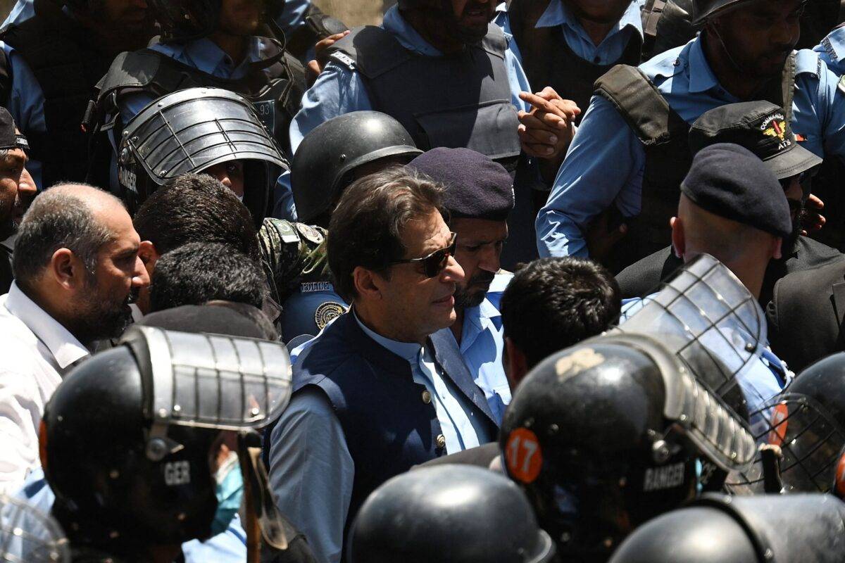 Police cammandos escort former Pakistan's Prime Minister Imran Khan (C) as he arrives at the high court in Islamabad on May 12, 2023 [AAMIR QURESHI/AFP via Getty Images]