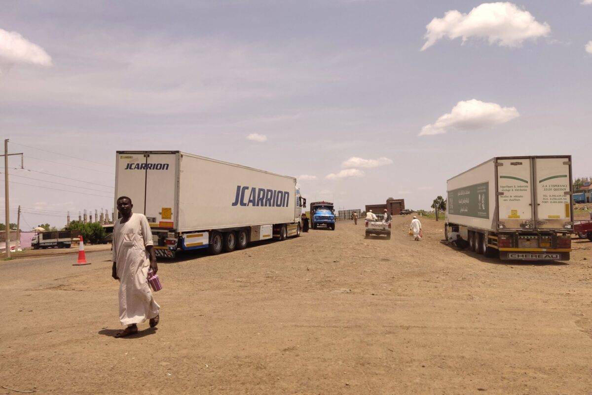 Trucks carrying foreign humanitarian aid pass by Gadaref on the main road linkin the Sudanse capital Khartoum with Port Sudan on July 10, 2023 [AFP via Getty Images]