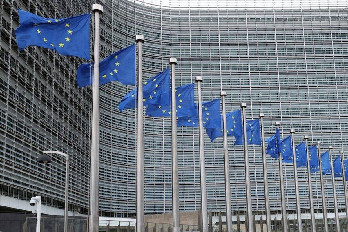 European Union flags are seen waving outside the EU Commission Building in Brussels, Belgium. [Dursun Aydemir/Anadolu Agency]