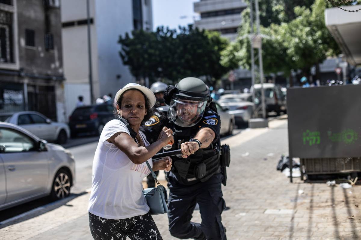 More than 100 people were injured in violent clashes in Tel Aviv between Eritrean government supporters celebrating an Eritrea Day event and opponents of President Isaias Afwerki. Israeli police fired stun grenades to break up the clashes, while some protesters hurled stones at police and set fire to trash bins, Reuters journalists at the scene said. Footage on social media showed Eritrean government supporters beating anti-government protesters with clubs. Israeli medical officials said more than 114 people had been treated for injuries, including about 30 police officers. The violence broke out around an event organised by the Eritrean embassy to mark Revolution Day on Sept. 1, which commemorates the start of the Eritrean War of Independence against Ethiopia in 1961. I Isaias has ruled since Eritrea gained independence in 1993. Human rights groups have condemned his government as being highly repressive and the country is under U.S. and EU sanctions for alleged abuses. "Why did we run from our country?," one protester in Tel Aviv, Hagos Gavriot, told Reuters. "Why the Israeli police gave them a permit to celebrate...for this dictator? We are against this. Why am I here seeking a shelter?" Reuters journalists saw men with head wounds and bloodied arms, some lying on the ground of a children's playground. Police marched through the streets firing stun grenades at protesters. "At this time, large police and Border Police forces continue to operate against lawbreakers in the Tel Aviv area," an Israeli police statement said. About 25,500 Eritrean asylum seekers currently live in Israel, according to Assaf, an organization that aids refugees. Eritreans who fled to Israel over its border with Egypt say they will face persecution if they are repatriated. Eritrea requires exit permits for its citizens and has a mandatory military draft.