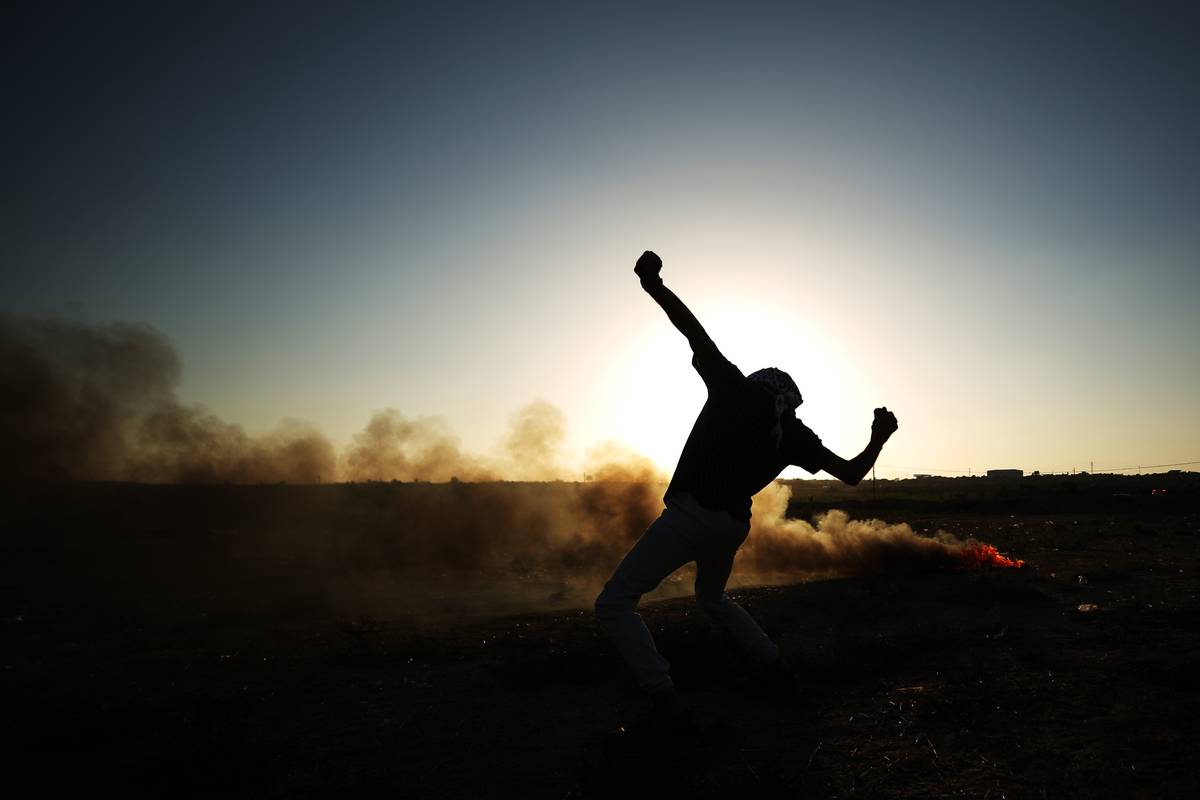 Palestinians throw stones in response to Israeli forces' interventions during a demonstration against Israeli forces' violations towards Masjid al-Aqsa in Gaza Strip on September 18, 2023 [Ali jadallah/Anadolu Agency]