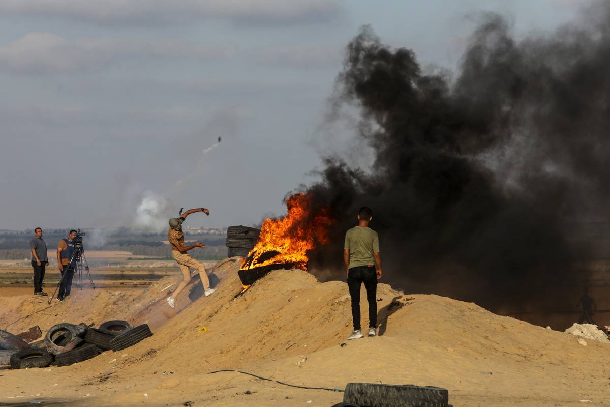 Palestinians set tires on fire and throw sound bombs during the demonstration that has been going on for a week against Israeli forces' violations towards Masjid al-Aqsa in Gaza Strip on September 23, 2023 [Abed Rahim Khatib - Anadolu Agency]