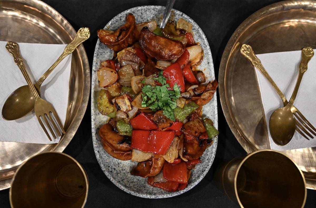 A view of food, which is belong to Nepali's cuisine is seen as serving to customer at Nepali restaurant in Taksim district of Istanbul, Turkiye on September 12, 2023. [Elif Öztürk Özgöncü - Anadolu Agency]