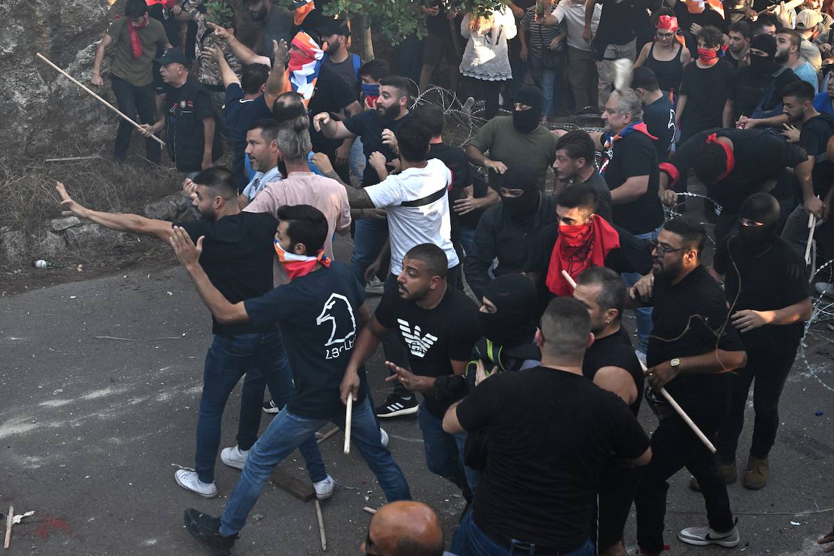 A group of Armenian gather near the Azerbaijani Embassy in Beirut, the capital of Lebanon and attack security forces on September 28, 2023. [Houssam Shbaro - Anadolu Agency ]
