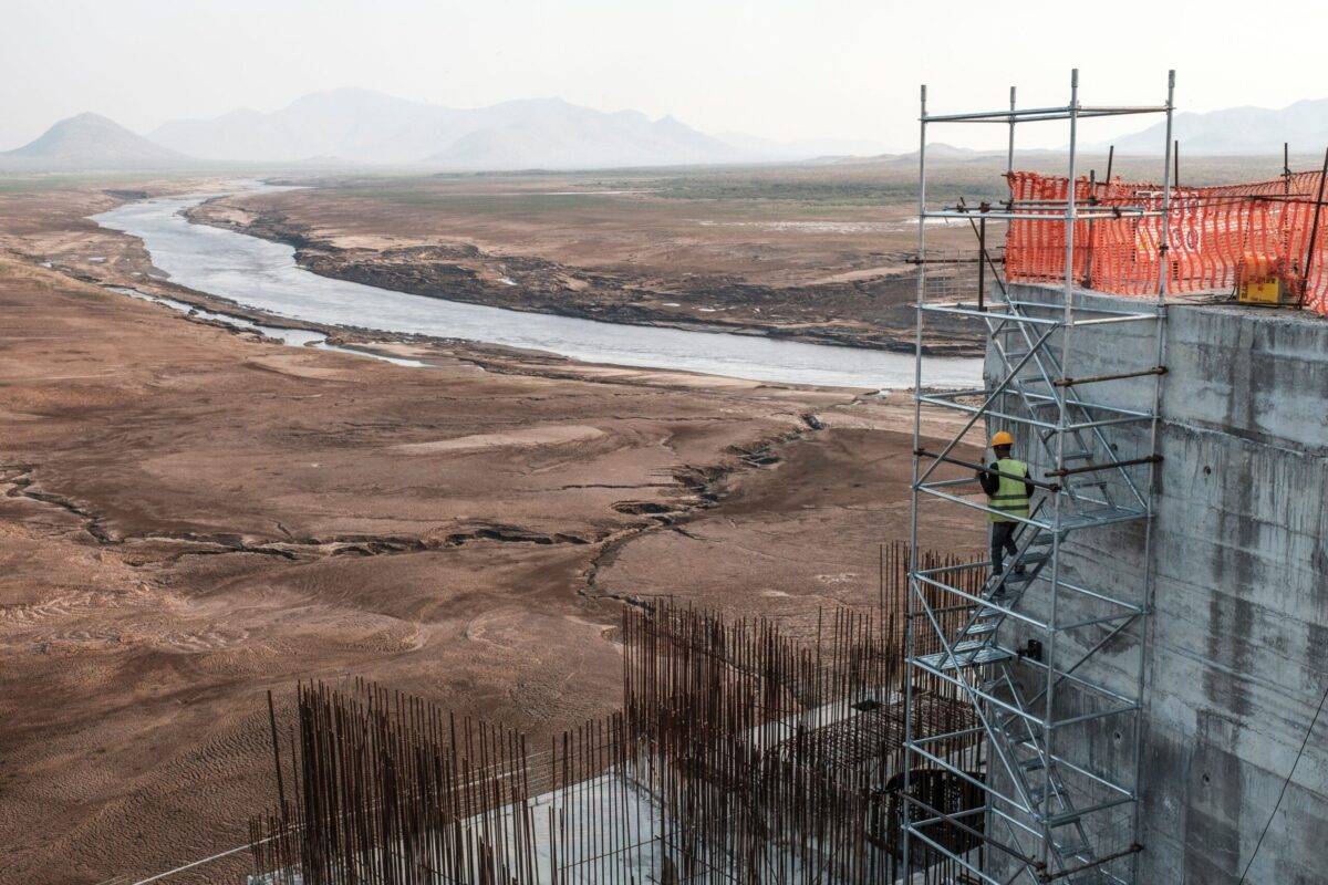 A worker goes down a construction ladder at the Grand Ethiopian Renaissance Dam (GERD), near Guba in Ethiopia, on December 26, 2019 [EDUARDO SOTERAS/AFP via Getty Images]