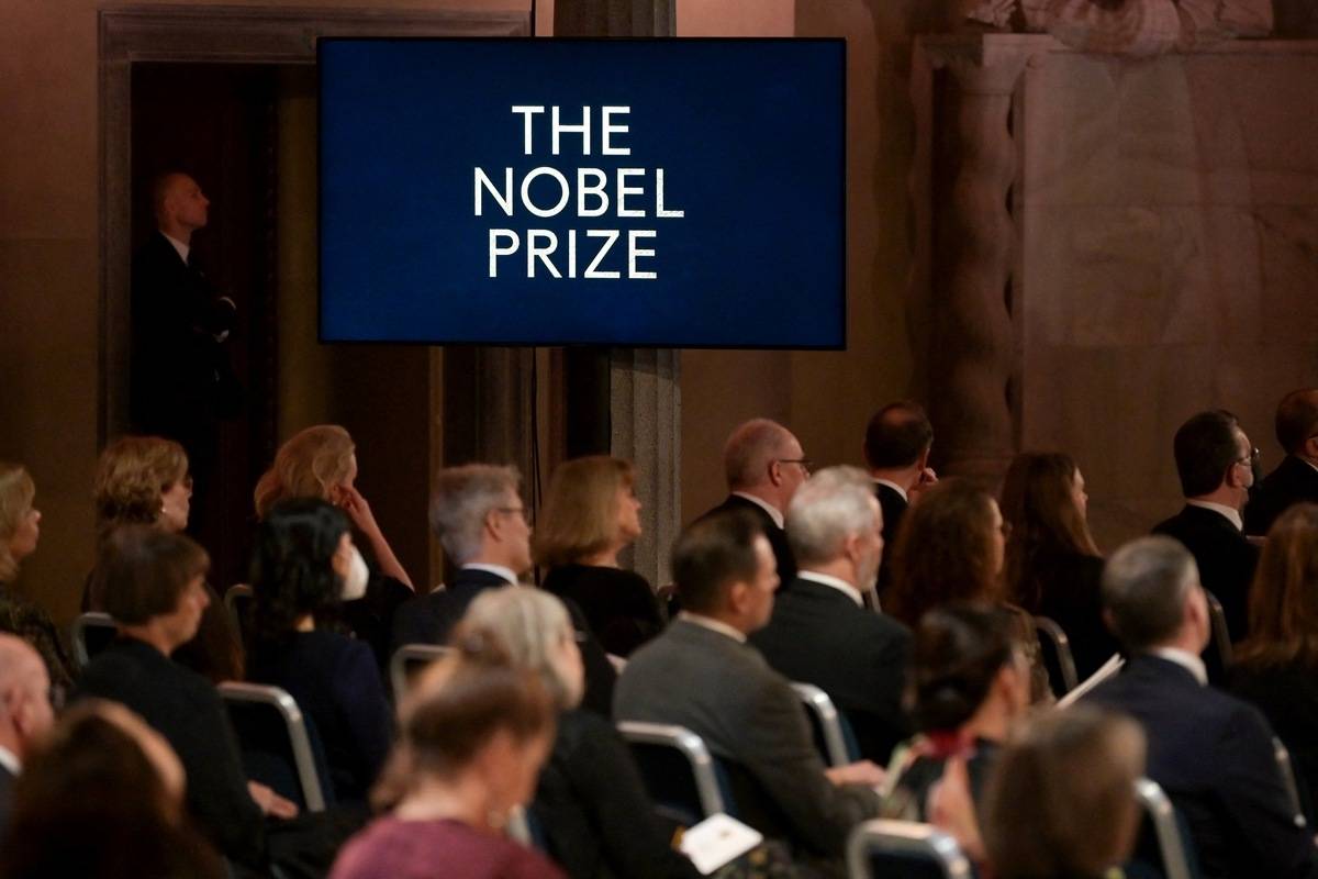 Guests attend a ceremony to pay tribute to the 2021 Nobel Prize laureates at the Stockholm City Hall in Stockholm, Sweden on December 10, 2021. [Photo by JONATHAN NACKSTRAND/AFP via Getty Images]