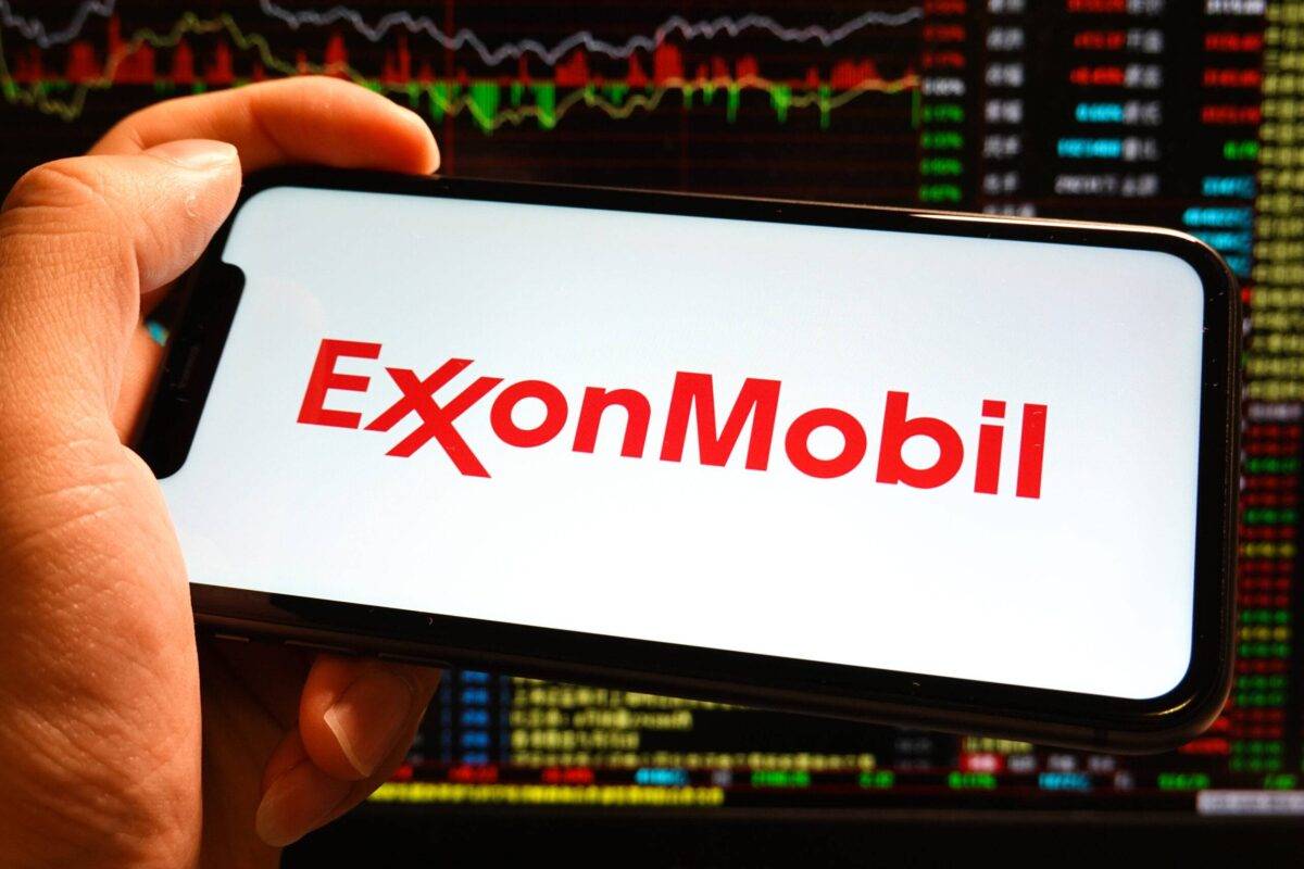 In this photo illustration, an ExxonMobil logo is displayed