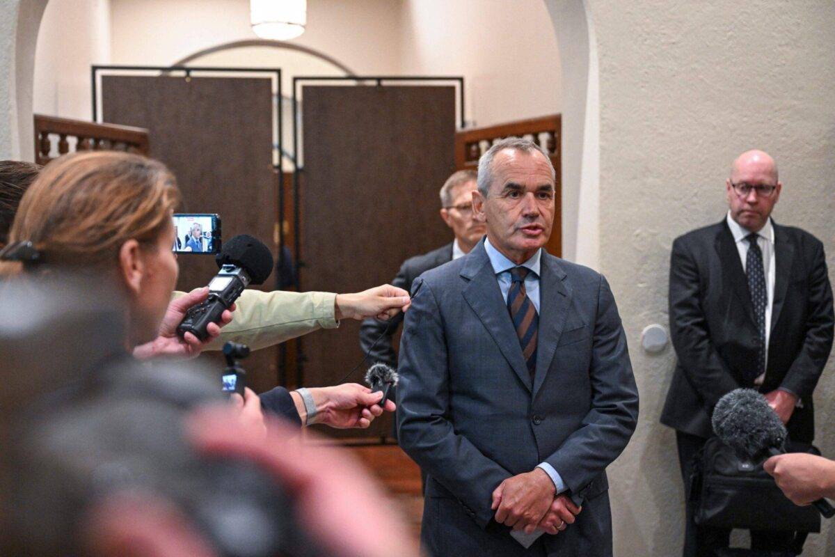 Ian Lundin (C), former chairman of the Swedish oil company Lundin Oil, gives a statement to the press upon arrival on September 5, 2023 to the District Court in Stockholm, Sweden [JONATHAN NACKSTRAND/AFP via Getty Images]