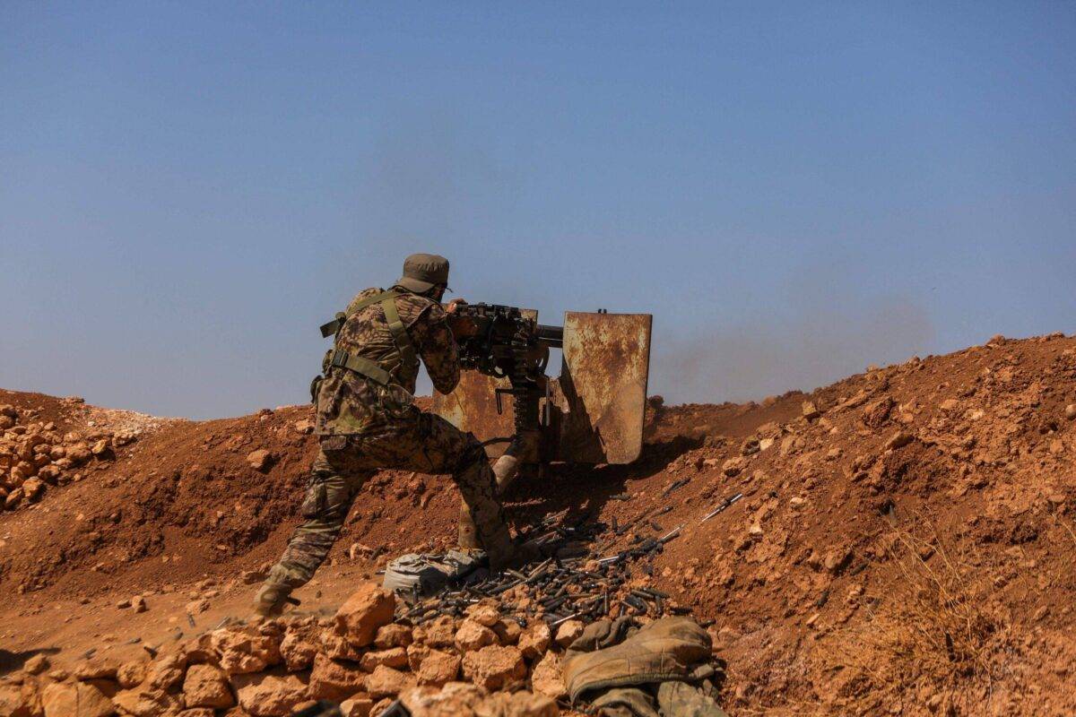 A fighter from the Turkish-supported forces mans a machine gun at the Buwayhij-Boughaz-Korhoyuk frontline on the outskirts of Manbij in northeastern Syria as they fight with US-backed Kurdish-led Syrian Democratic Forces (SDF) on September 6, 2023 [BAKR ALKASEM/AFP via Getty Images]
