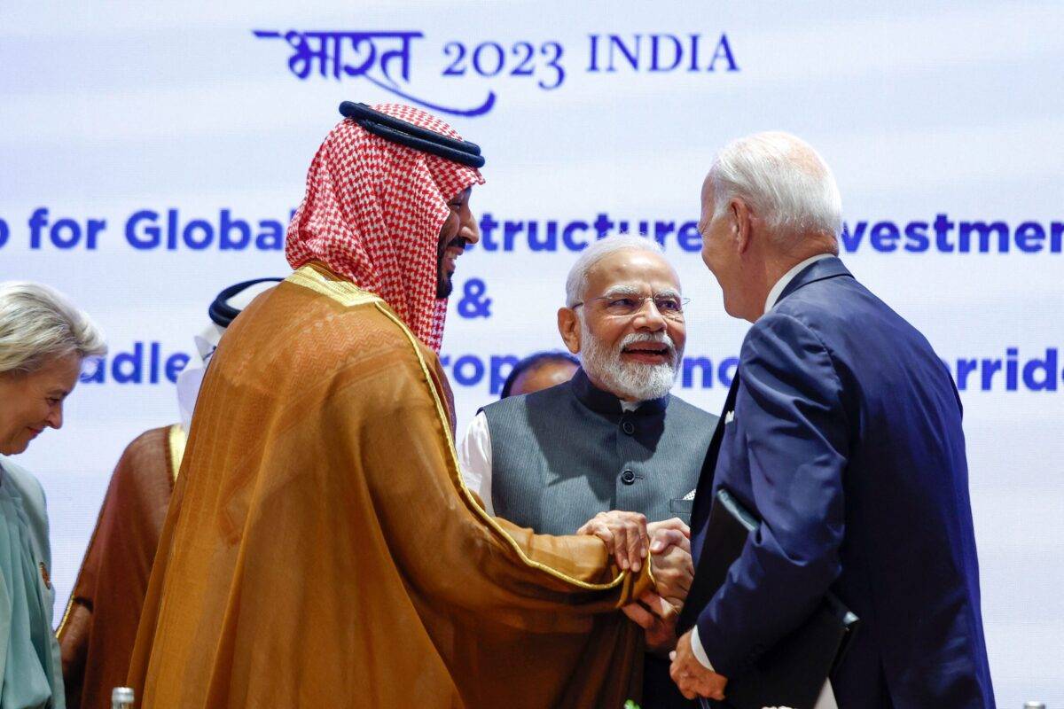 India's Prime Minister Narendra Modi (2R), US President Joe Biden (R) and Saudi Arabia's Crown Prince and Prime Minister Mohammed bin Salman hold hands before the start of a session at the G20 summit in New Delhi on September 9, 2023 [EVELYN HOCKSTEIN/POOL/AFP via Getty Images]