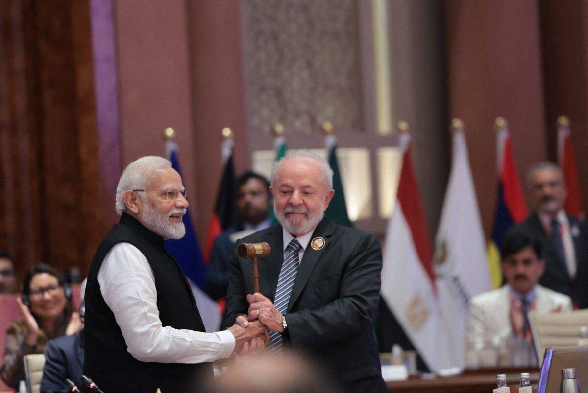 India's Prime Minister Narendra Modi (L) hands over the gavel to Brazil's President Luiz Inacio Lula da Silva (R) during the third working session of the G20 Leaders' Summit in New Delhi on September 10, 2023 [PIB/AFP via Getty Images]