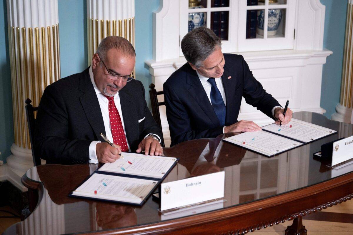 Bahrain's Prime Minister and Crown Prince Salman bin Hamad al-Khalifa and US Secretary of State Antony Blinken sign a security integration and prosperity agreement at the US Department of State on September 13, 2023, in Washington, DC [BRENDAN SMIALOWSKI/AFP via Getty Images]