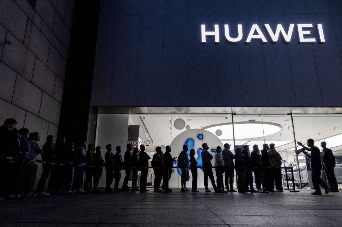 People line up to buy or reserve a new Mate 60 smartphone outside a Huawei flagship store after the company unveiled new products on September 25, 2023 in Beijing, China [Kevin Frayer/Getty Images]