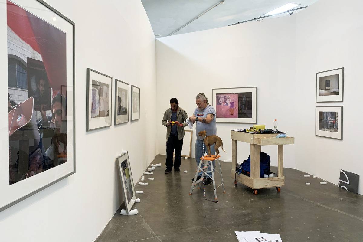 Installing the work of Ahlam Shibli [Photo by Anna Juni for Sao Paulo Biennial]
