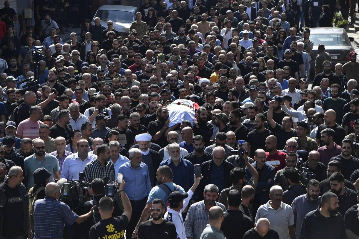 People attend the funeral ceremony of Reuters journalist Issam Abdallah, who was killed by Israeli forces while working in southern Lebanon in Khiam town of Nabatieh Governorate, Lebanon on October 14, 2023 [Houssam Shbaro - Anadolu Agency]
