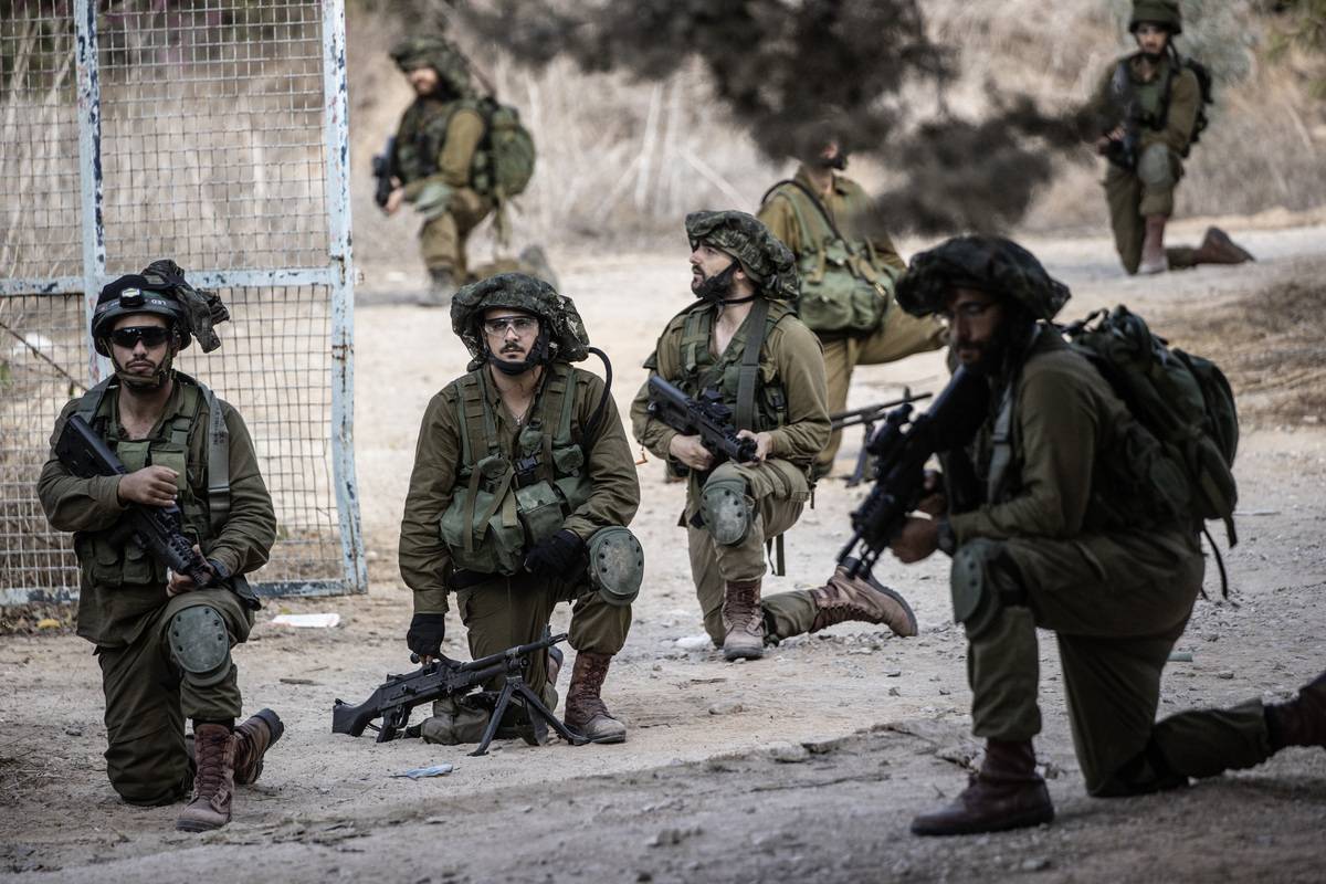 Soldiers of Israeli army patrol in Kfar Aza settlement of southern Israel near Gaza border in Kfar Aza, Israel on October 15, 2023. [Mostafa Alkharouf - Anadolu Agency]