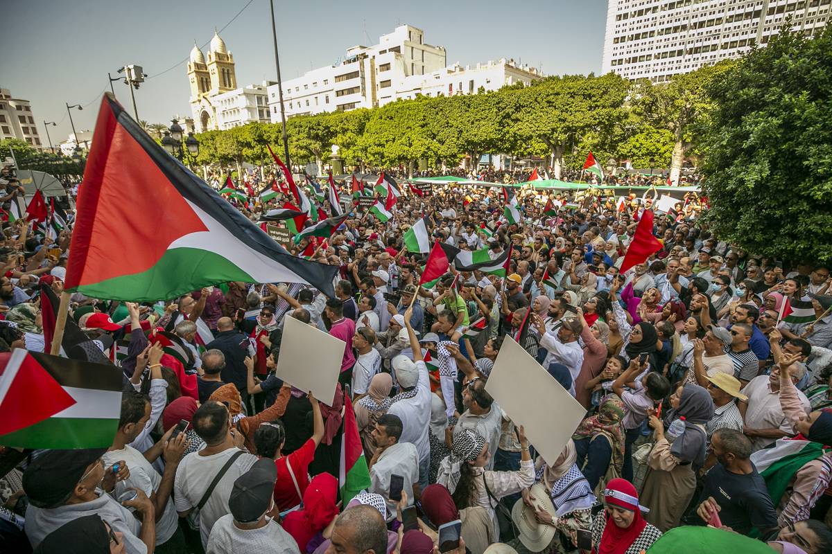 People carry Palestinian flags as they stage a demonstration in support of Palestinians on Avenue Habib Bourguiba in Tunis, Tunisia on October 15, 2023. [Yassine Gaidi - Anadolu Agency]