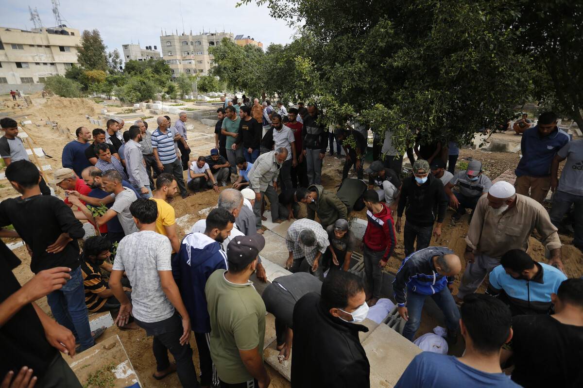 Palestinians attend the funeral prayer of the Palestinians who died during the Israeli airstrikes in Dair Al-Balah, Gaza on October 17, 2023 [Ashraf Amra - Anadolu Agency]