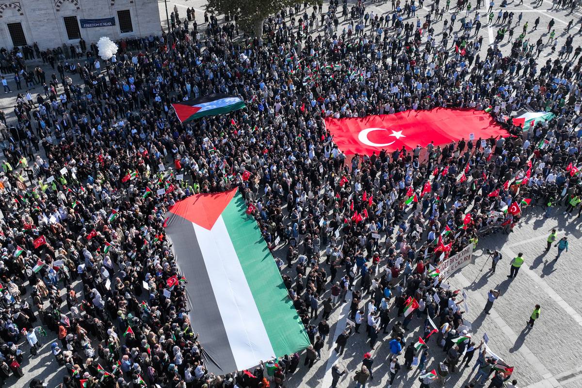 An aerial view of hundreds of people staging a demonstration to express their solidarity with Palestinians and protest Israel's airstrikes on Gaza, at Beyazit square in Istanbul, Turkiye on October 20, 2023. [Muhammed Enes Yıldırım - Anadolu Agency]