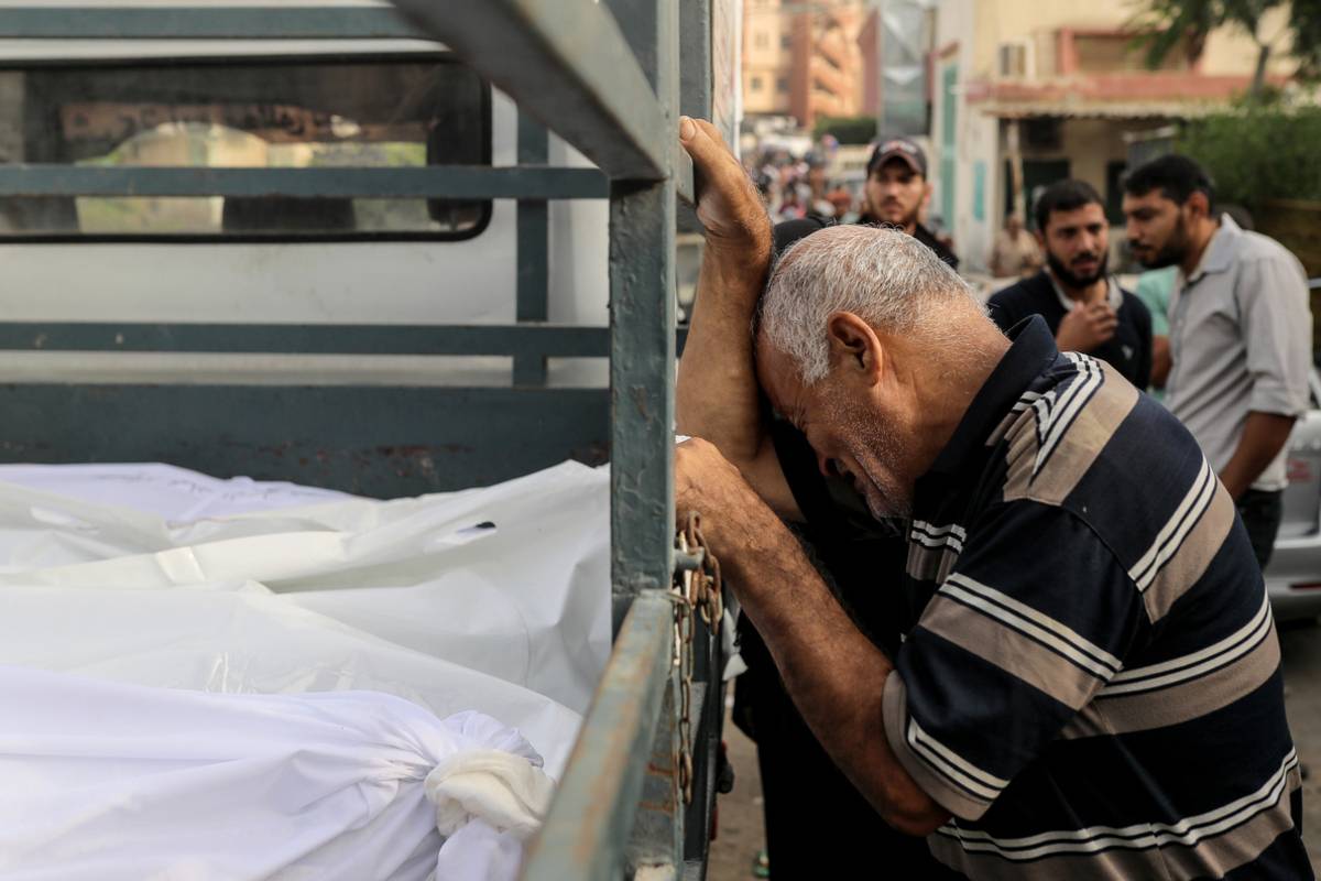 A relative of a person who killed in Israeli attacks and brought to the morgue of the Nasser Hospital, mourns as Israeli airstrikes continue in the 19th day in Khan Yunis, Gaza on October 25, 2023. [Belal Khaled - Anadolu Agency]
