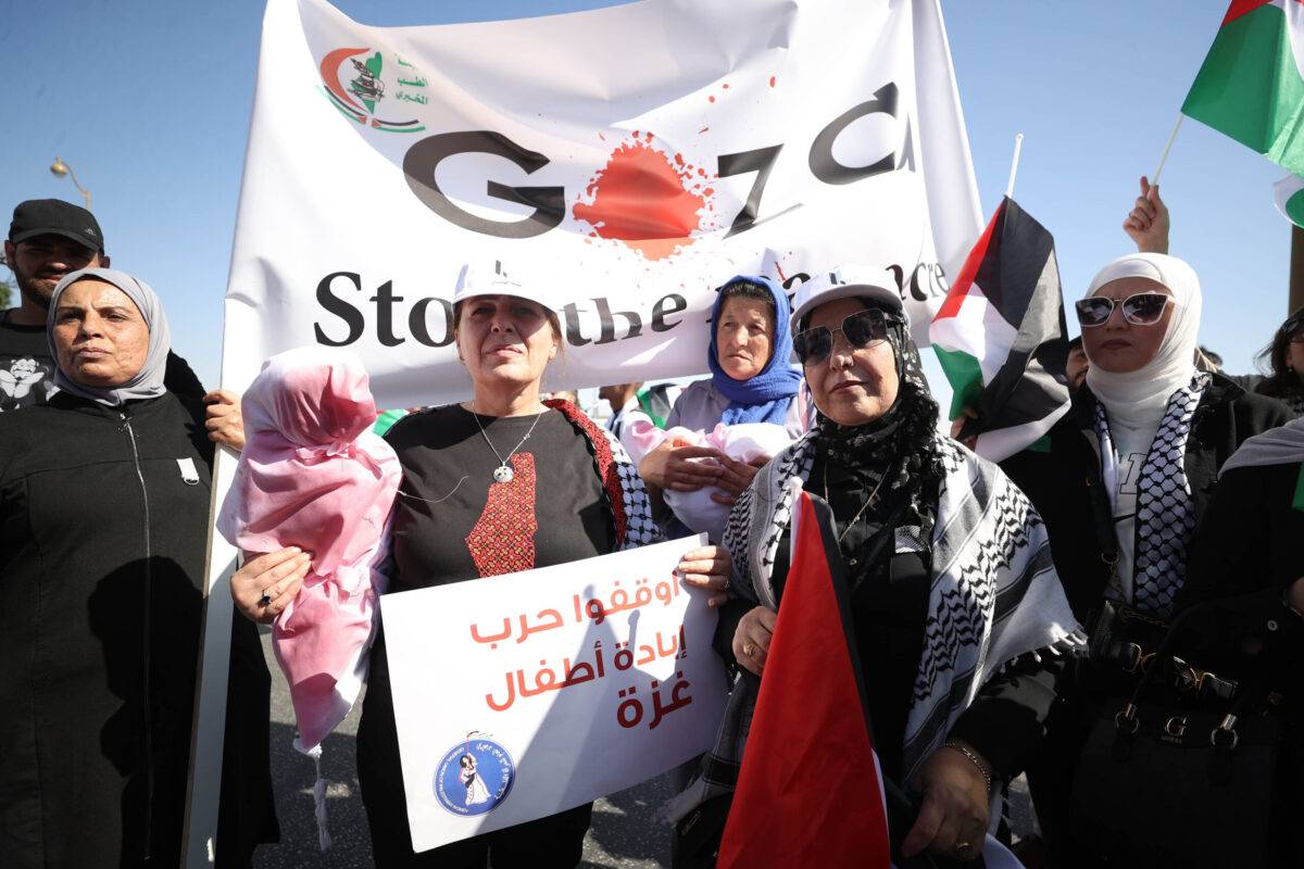 People, holding banners and flags, gather to protest against Israeli attacks on Gaza in Ramallah, West Bank on October 25, 2023 [Issam Rimawi/Anadolu Agency]