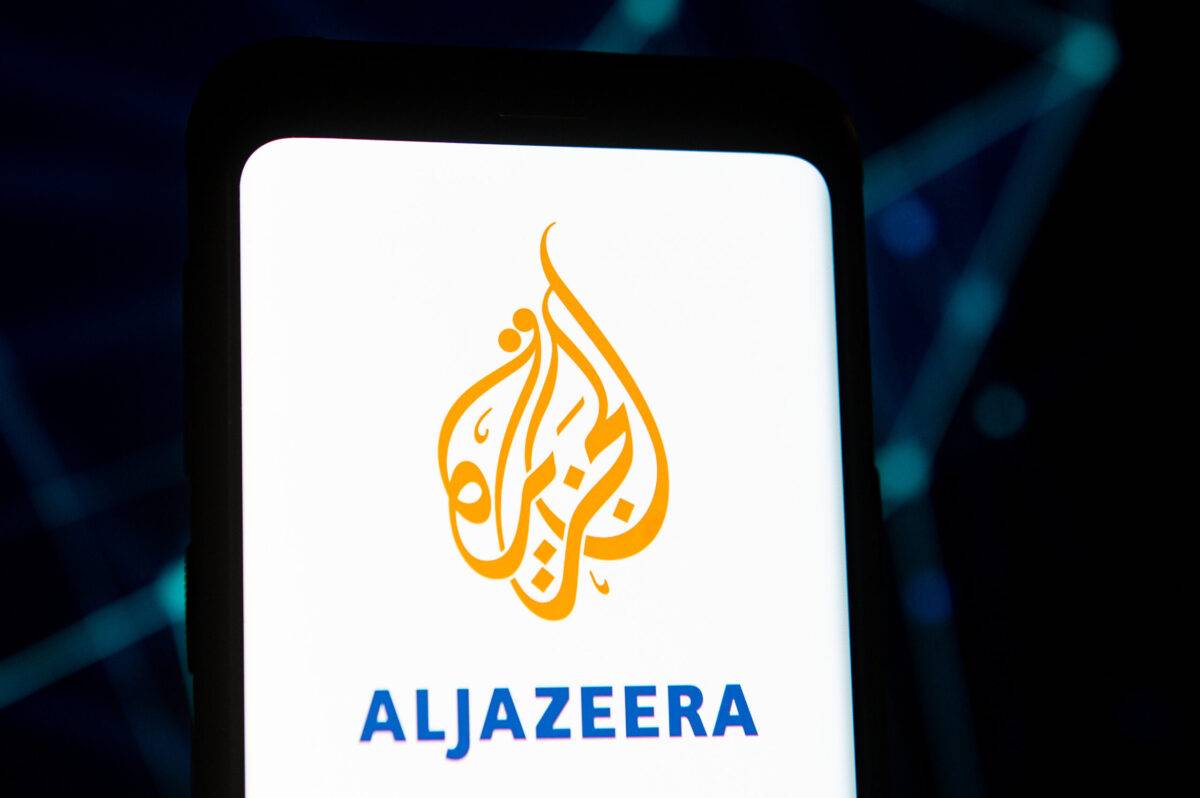 In this photo illustration an Aljazeera logo seen displayed