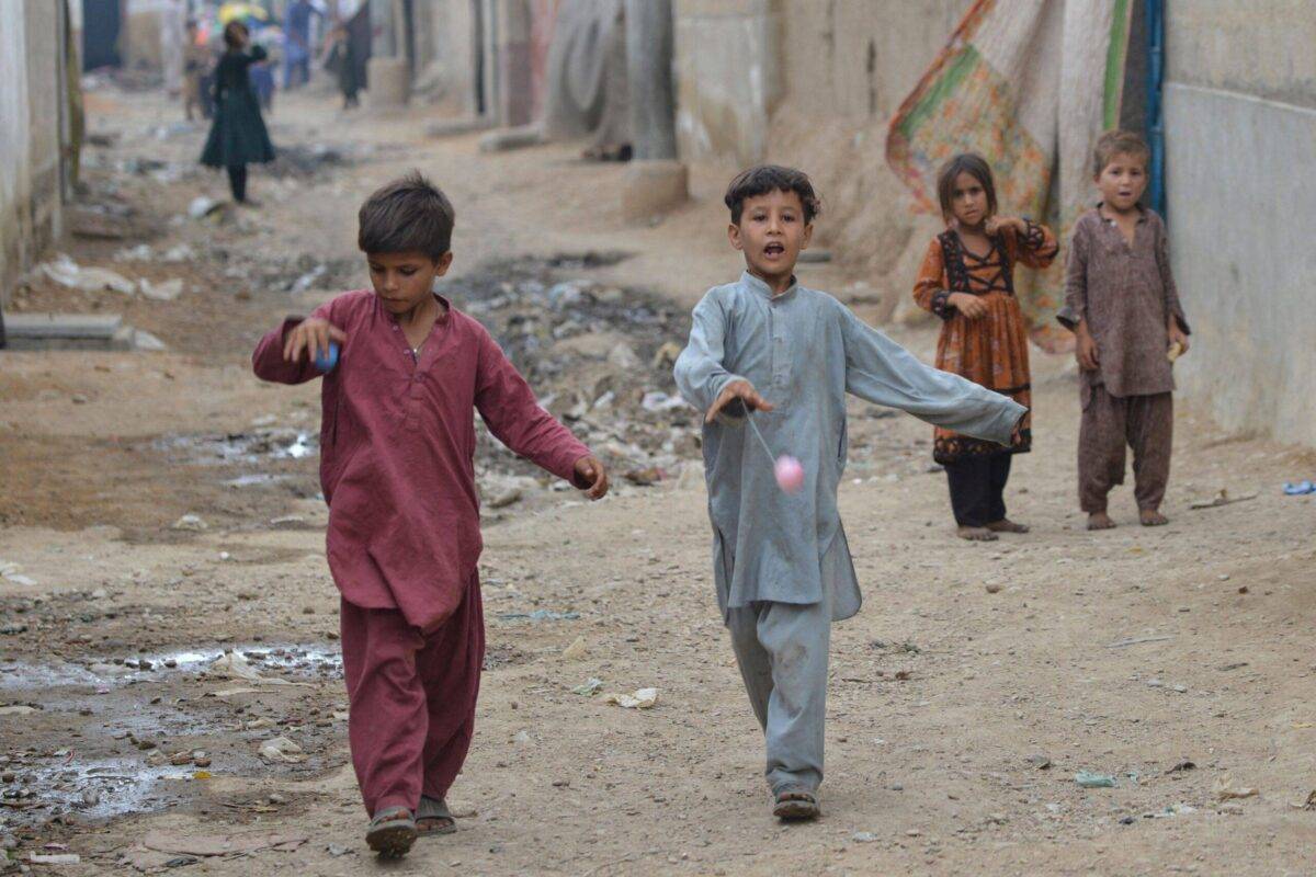 In this photo taken on September 21, 2023, Afghan children play at an Afghan refugee camp in Karachi [RIZWAN TABASSUM/AFP via Getty Images]
