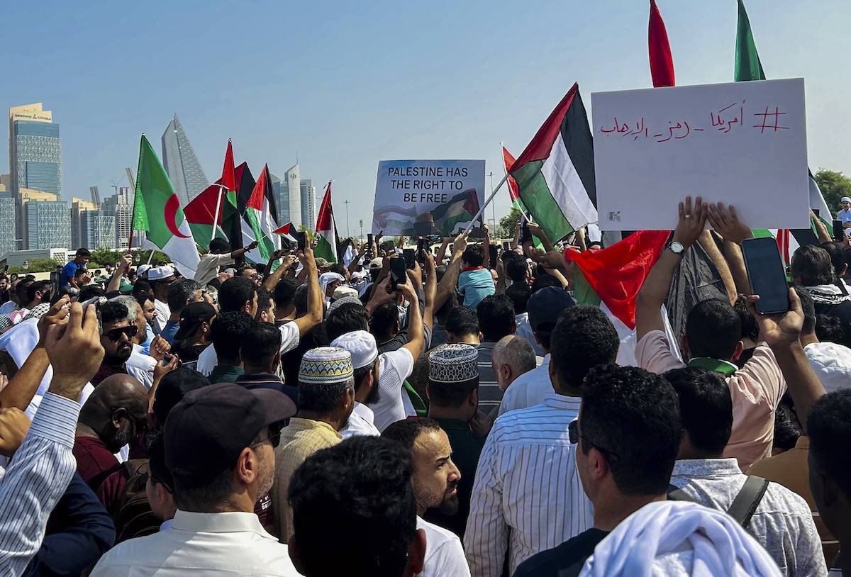 People wave the Palestinian flag during a protest supporting the Palestinian people following Friday Noon prayers outside the Imam Muhammad Abdel-Wahhab Mosque in Doha,Qatar on 20 October 2023 [Noushad Thekkayil/NurPhoto via Getty Images]