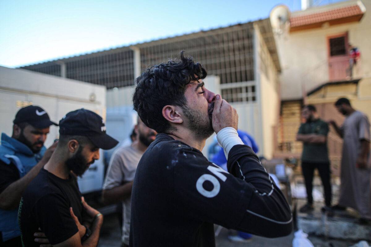 Relatives of the Palestinians, who lost their lives after Israeli attacks, mourn as the bodies are carried for burial from Al Aqsa Martyrs Hospital on the 25th day Deir Al-Balah, Gaza on October 31, 2023 [Mustafa Hassona/Anadolu via Getty Images]