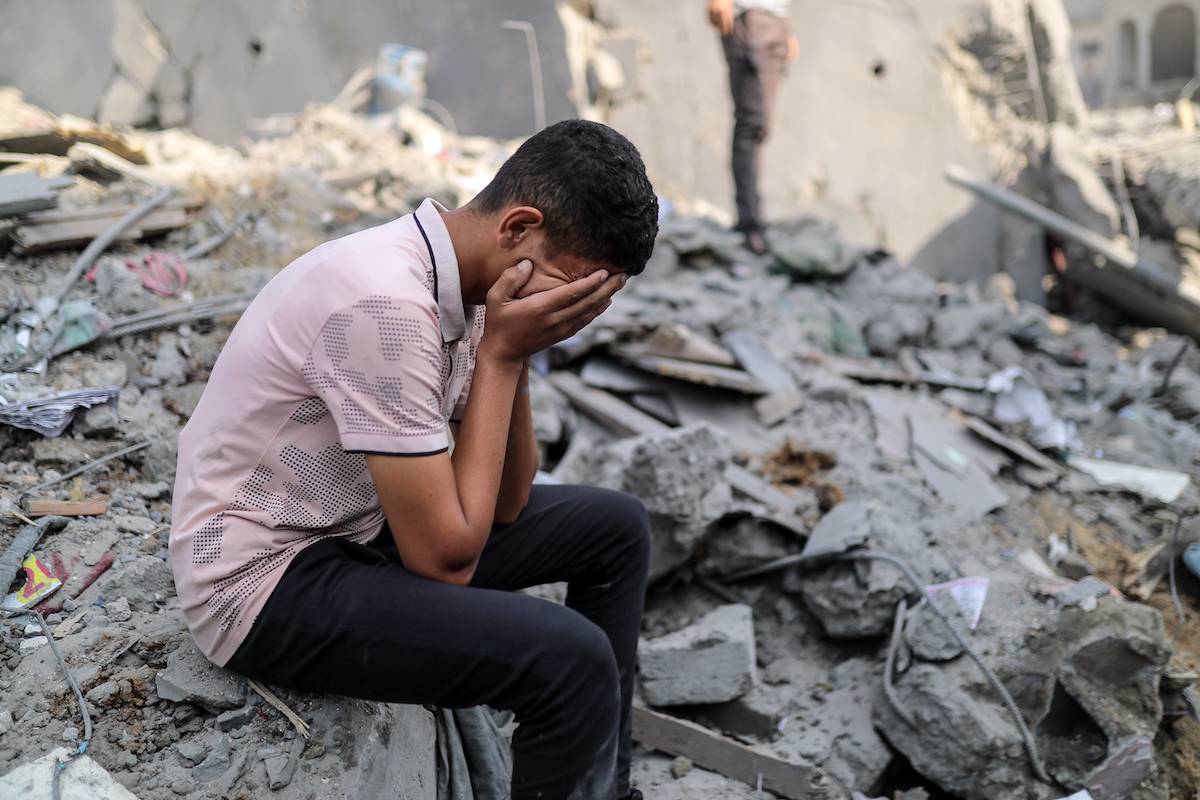 A Palestinian is seen amid destruction caused by Israeli airstrikes on Bureij refugee camp located in central Gaza Strip on November 02, 2023 [Belal Khaled - Anadolu Agency]