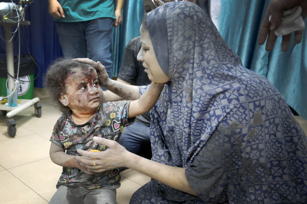 An injured child is brought to the Al Aqsa Hospital after the Israeli attack on Maghazi Refugee Camp in Deir al Balah, Gaza on November 03, 2023 [Ashraf Amra - Anadolu Agency]