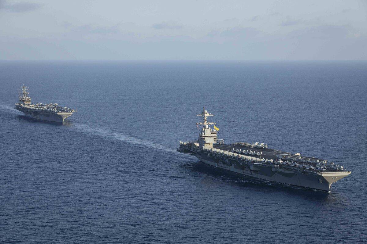 An aerial view of aircraft carriers of the United States Navy USS Gerald R. Ford and USS Dwight D. Eisenhower together in eastern Mediterranean on November 03, 2023. [U.S. Navy Malachi Lakey/Handout - Anadolu Agency]