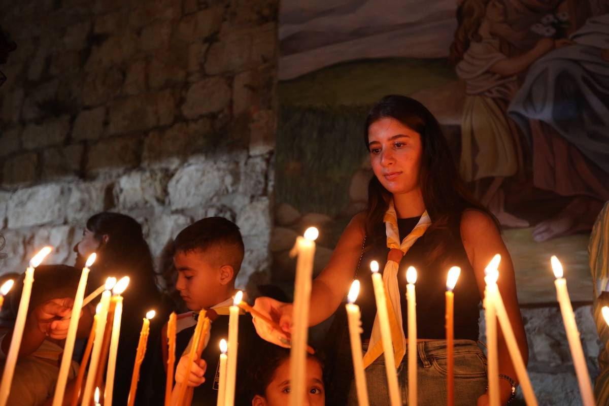 Members of Christian communities gather at the Terra Sancta to pray and light candles for the end of the war in Gaza Strip and end for the blockade of West Bank, in which 15 Palestinians lost their lives today, in Jerusalem on November 09, 2023. [Ameer Abed Rabbo - Anadolu Agency]