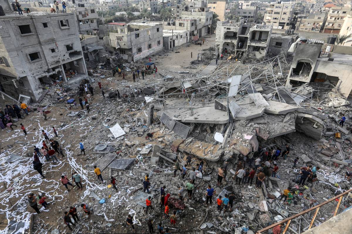 Civil defense teams and civilians conduct a search and rescue operation under the rubbles of demolished buildings following the Israeli attacks in Rafah, Gaza on November 11, 2023. [Abed Rahim Khatib - Anadolu Agency]