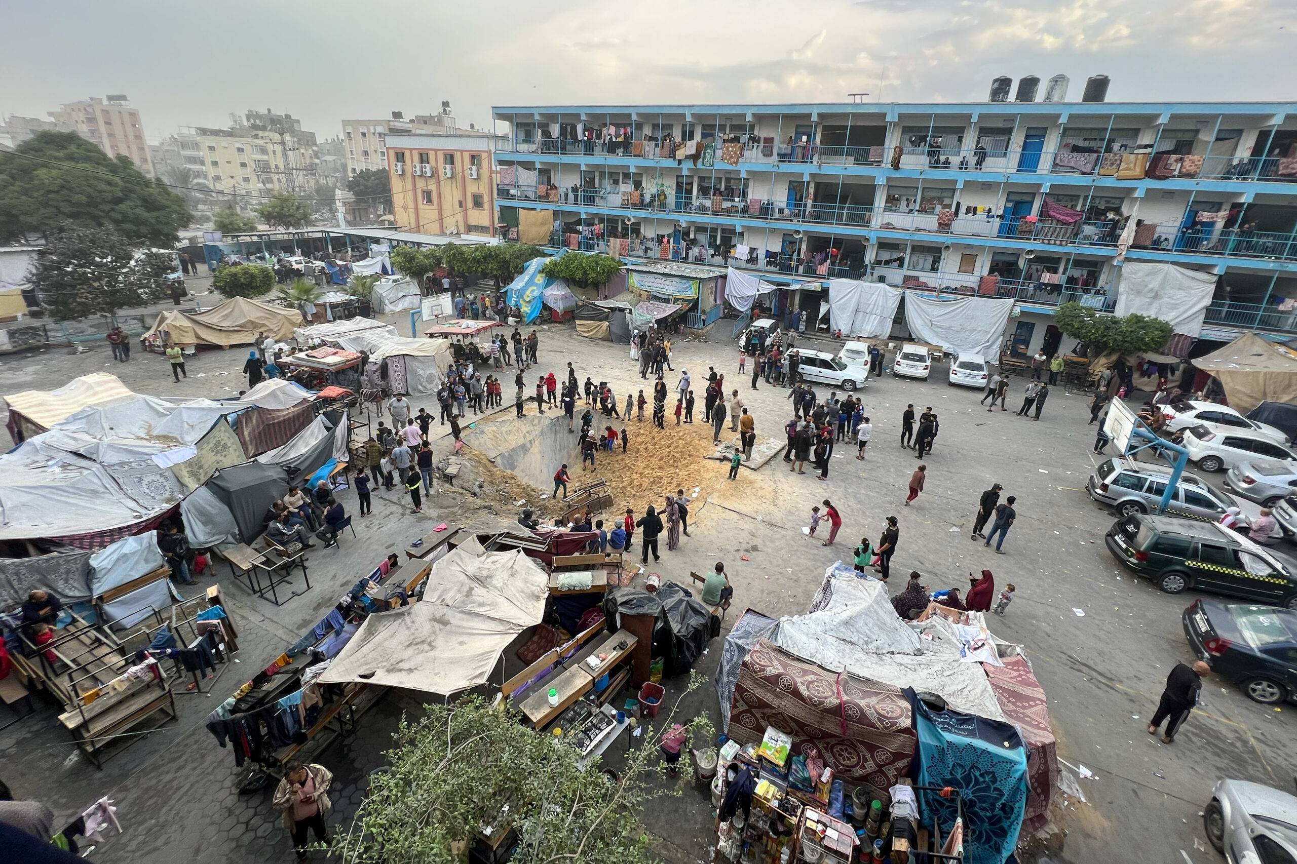 A view of pit formed on the backyard of United Nations Relief and Works Agency for Palestine Refugees (UNRWA) school used as a sheltering place for displaced Palestinians, after Israeli airstrikes at Jabalia refugee camp in Gaza City, Gaza on November 12, 2023 [Fadi Alwhidi - Anadolu Agency]